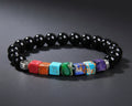 7 Chakra Naturstein Armband mit schwarzen 8mm Onyx-Perlen, bunten Wuerfel-Chakra-Steinen und silberner Lebensbaum-Perle